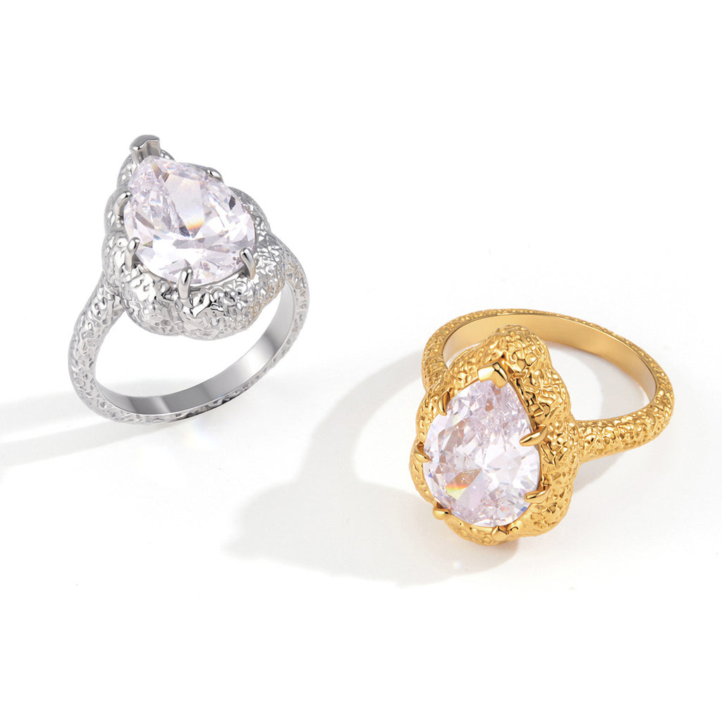 Large clear stone rings on white