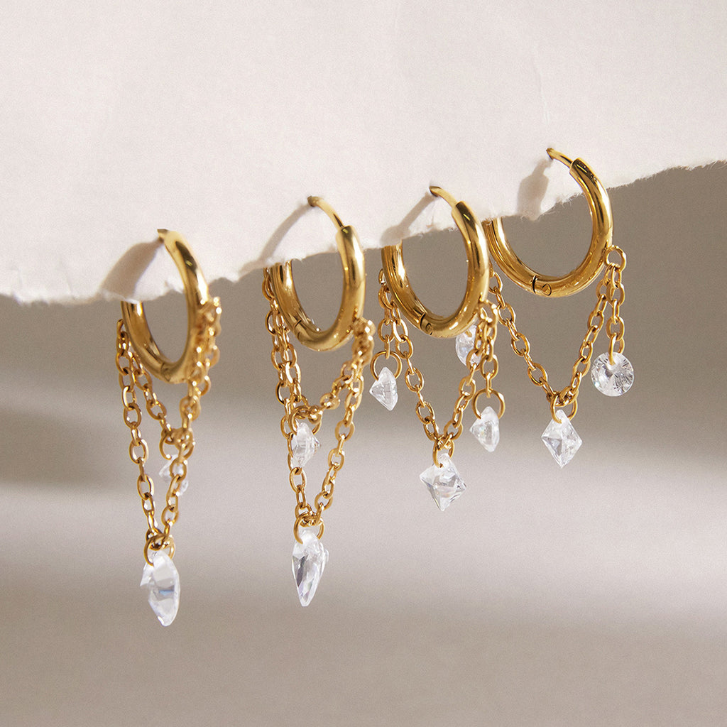 Two styles of gold tone chain-draped hoop earrings