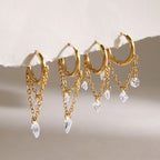 Two styles of gold tone chain-draped hoop earrings