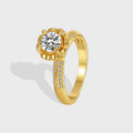 isolated gold plated round clear stone solitaire ring