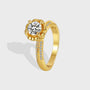 isolated gold plated round clear stone solitaire ring