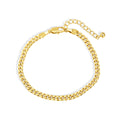curved display of gold plated brass Cuban bracelet