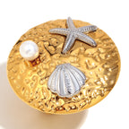 isolated two-tone starfish shell and pearl statement ring
