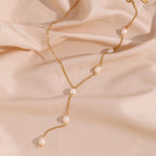 delicate gold plated Y chain with spaced white freshwater pearls