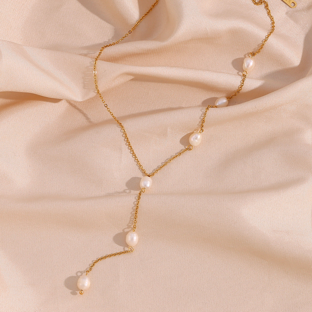 delicate gold plated Y chain with spaced white freshwater pearls
