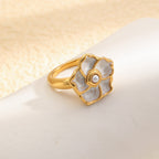 angled view of gold plated ivory flower cocktail ring