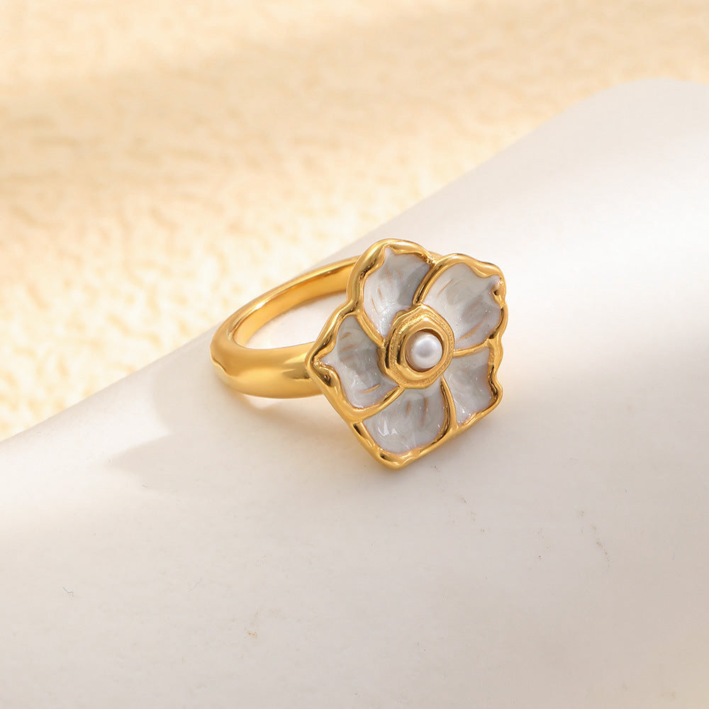 angled view of gold plated ivory flower cocktail ring
