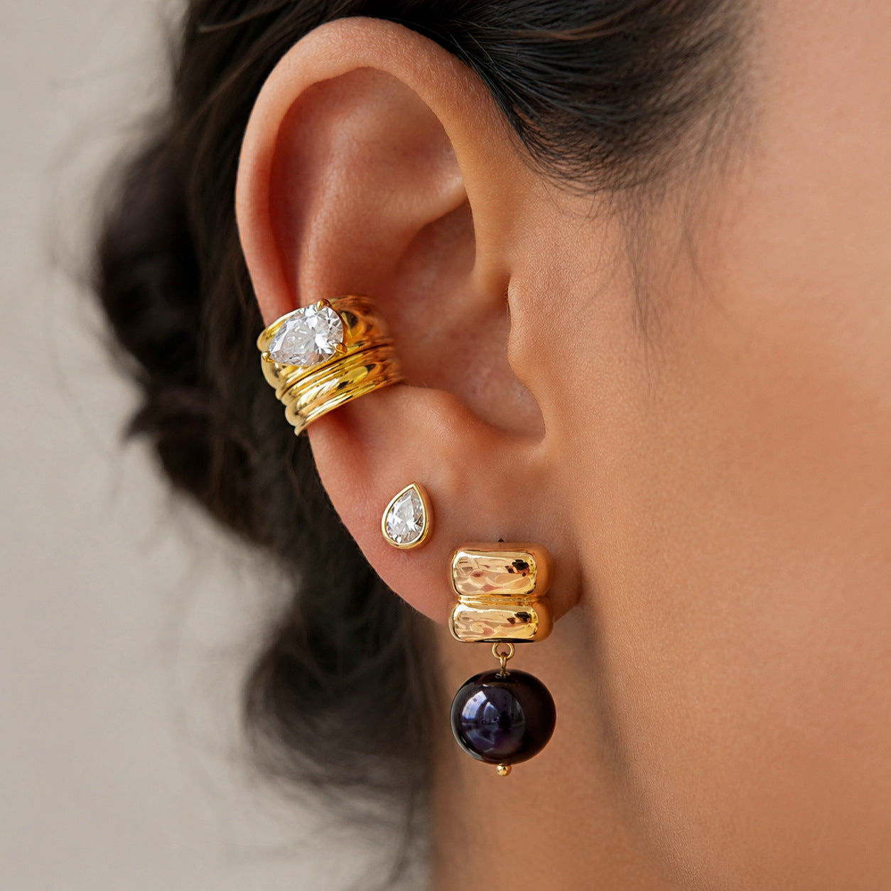 Black resin bead drop earring styled with other jewelry