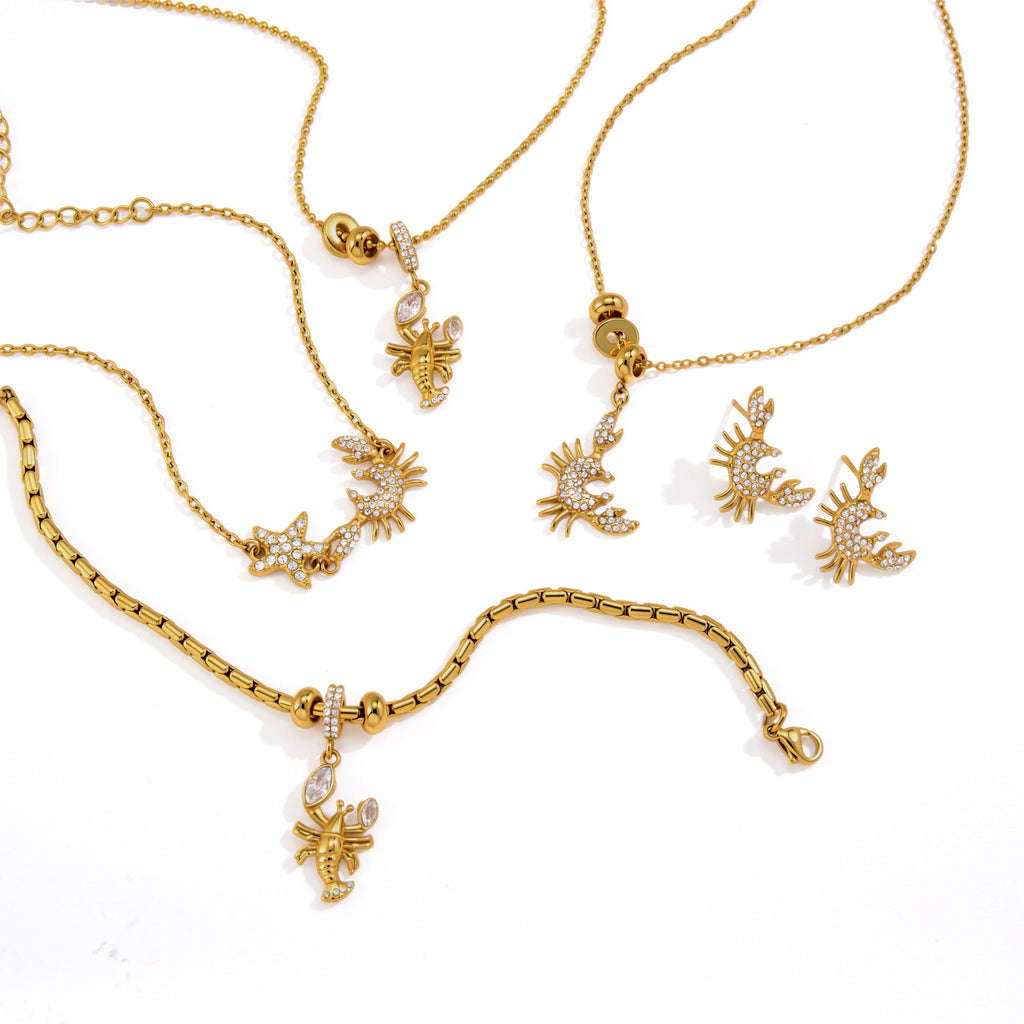 Crab and lobster jewelry selection on white