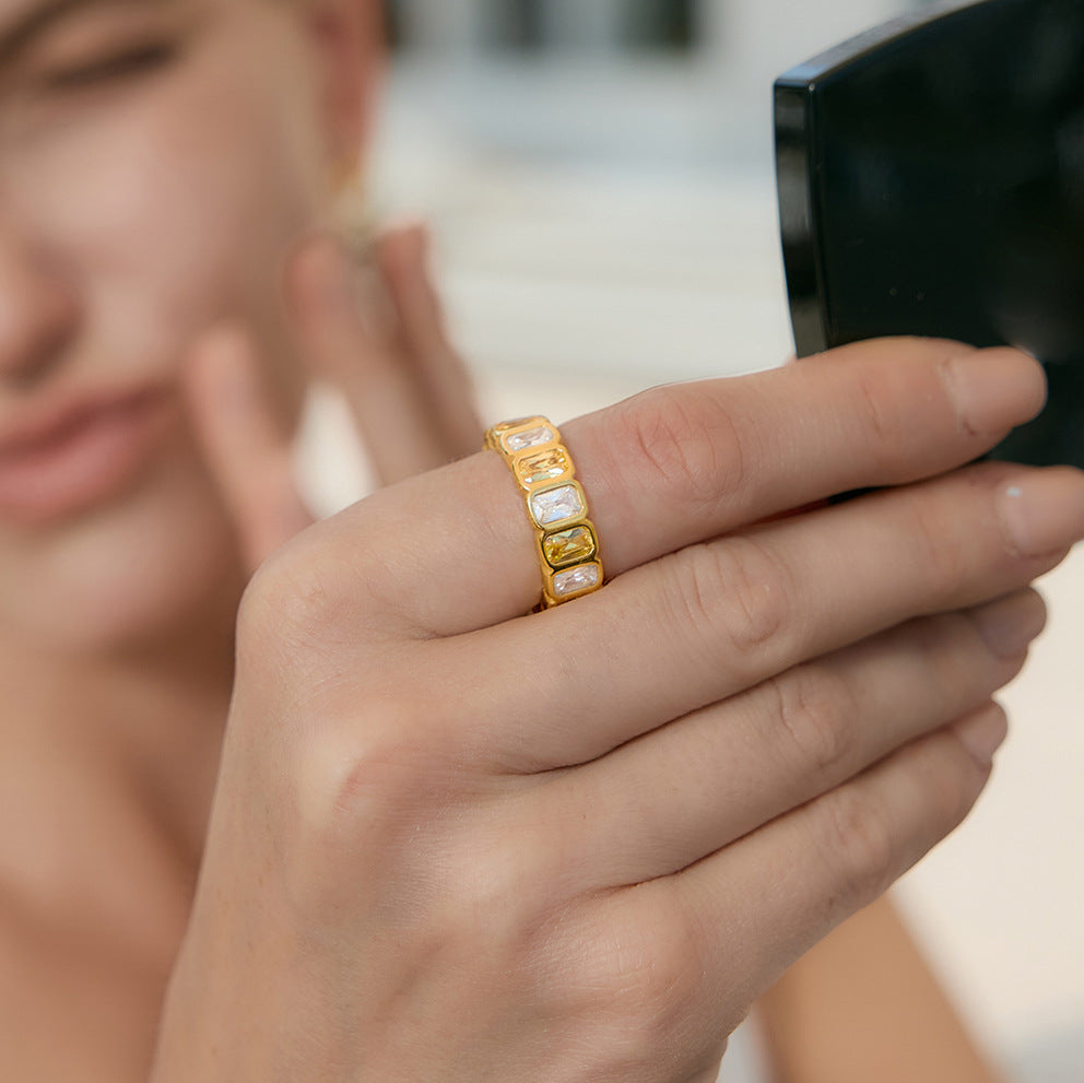 Yellow-accent rectangular stone band worn close-up