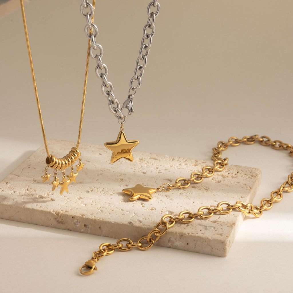 Star pendant and clustered star necklaces displayed together