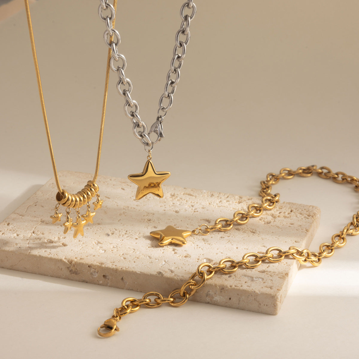 Star pendant and clustered star necklaces displayed together