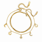 Celestial charm and fine-chain anklets on white
