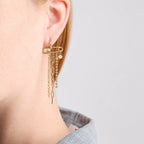 Side view of mixed chain strands beneath a gold tone hoop