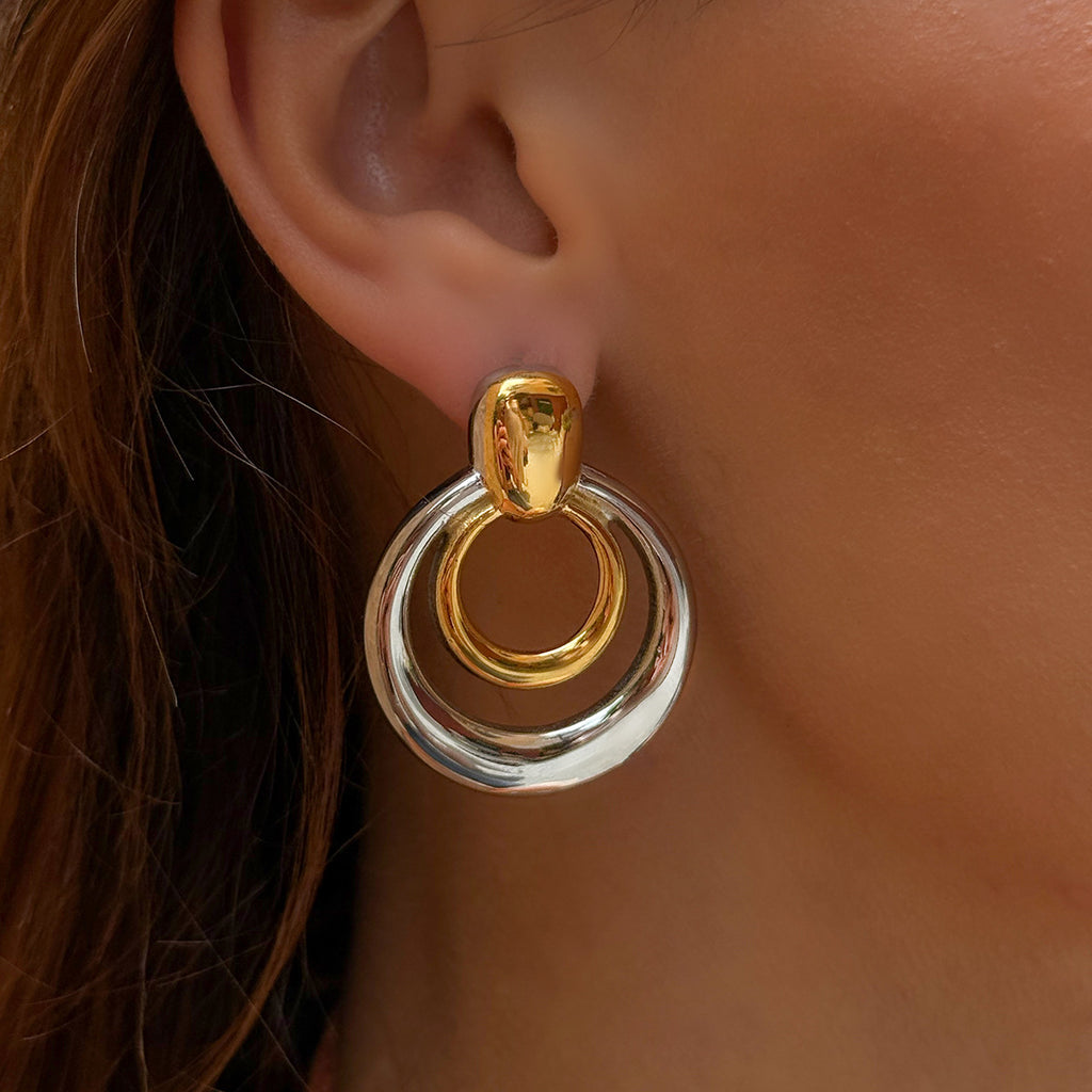 Two-Tone Circular Stainless Steel Statement Stud Earrings — styled view
