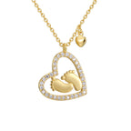 isolated gold plated baby footprint heart pendant necklace