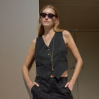 Long paperclip necklace shown on a model