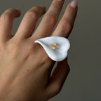 White calla lily statement ring worn on a hand