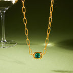 cushion-shaped green glass centerpiece on elongated-link chain