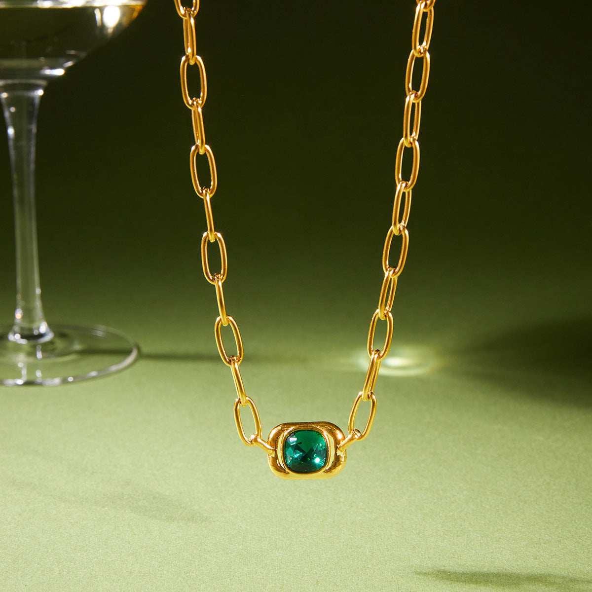 cushion-shaped green glass centerpiece on elongated-link chain
