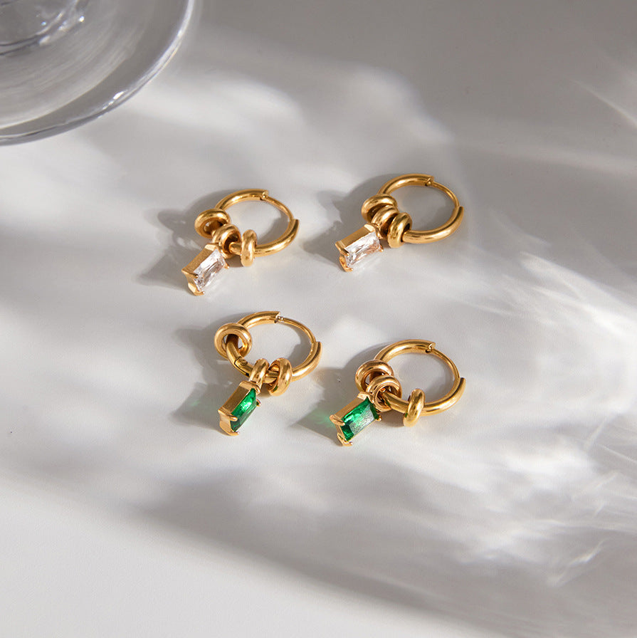 Clear and green rectangular stone hoops arranged together