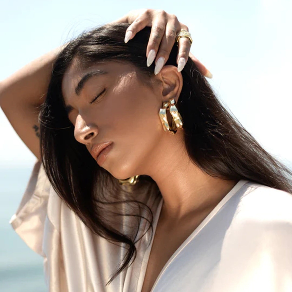 Gold Plated Sculptural Petal Stainless Steel Hoop Earrings – product view 1