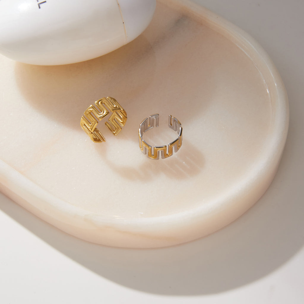Open backs of gold tone and mixed-tone patterned rings