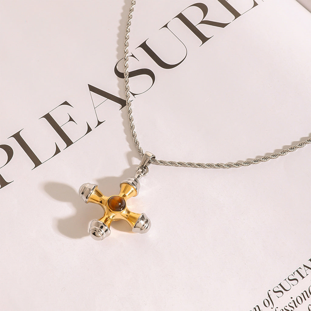 Close view of the rounded cross pendant and rope-style chain