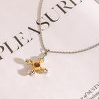 Close view of the rounded cross pendant and rope-style chain