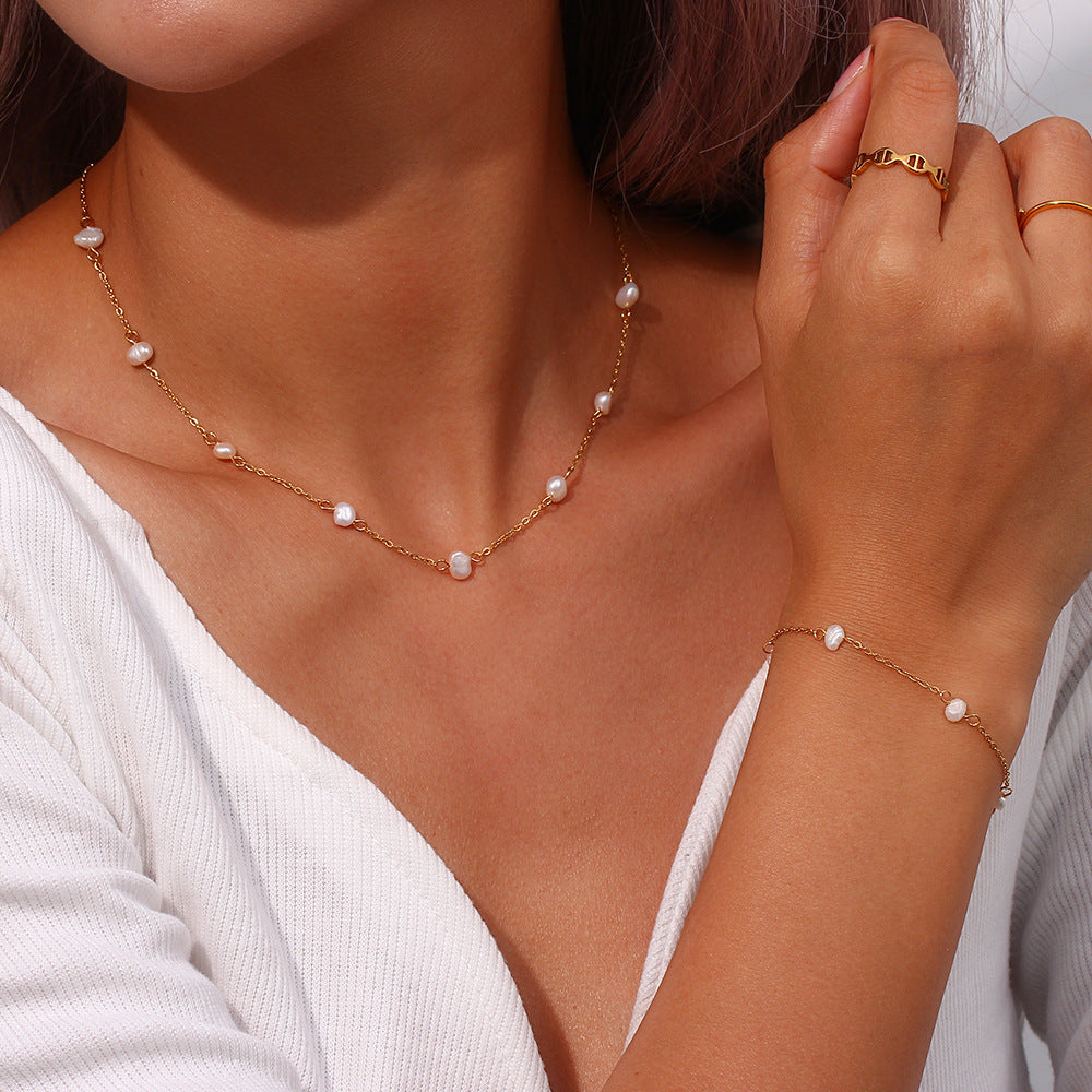Bracelet and necklace styled together on a model