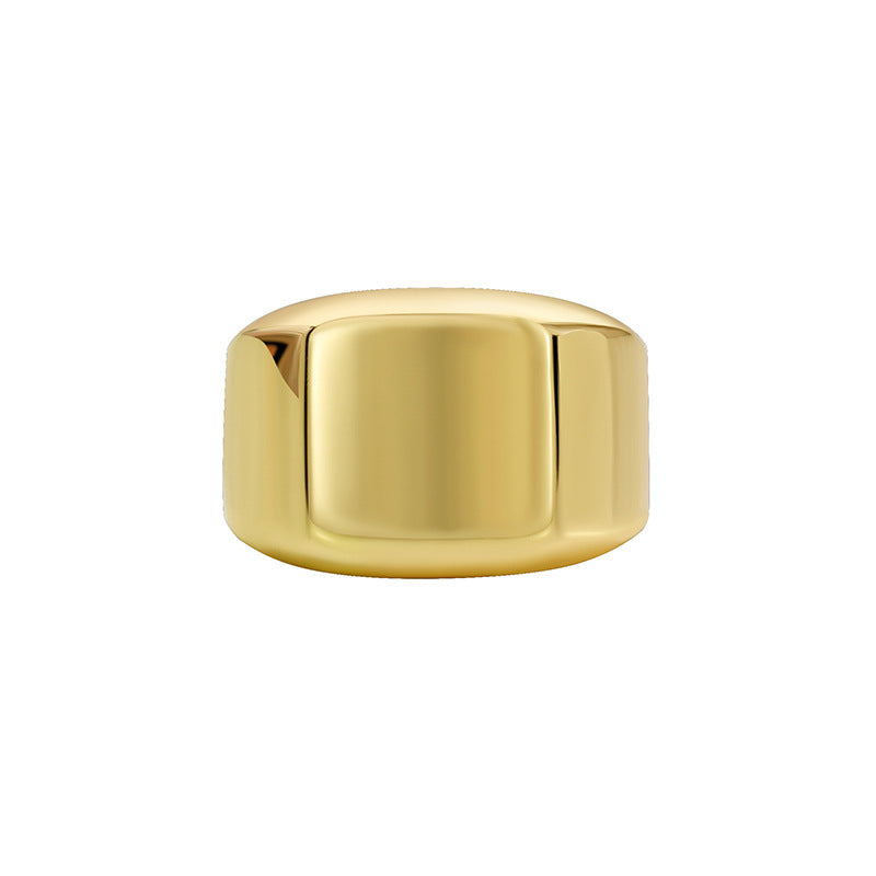 isolated gold plated square signet ring on white