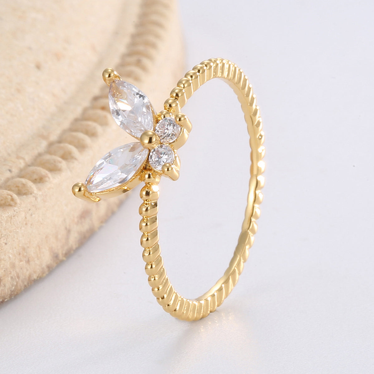 upright view of the clear stone butterfly and beaded band