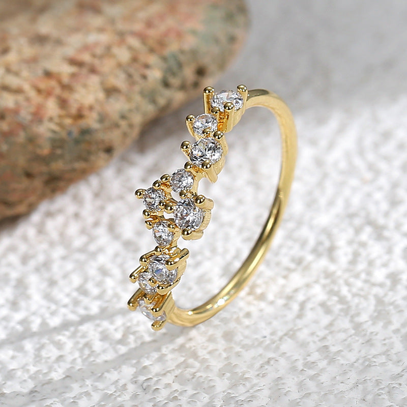 side angle of asymmetric half-band clear-stone cluster ring