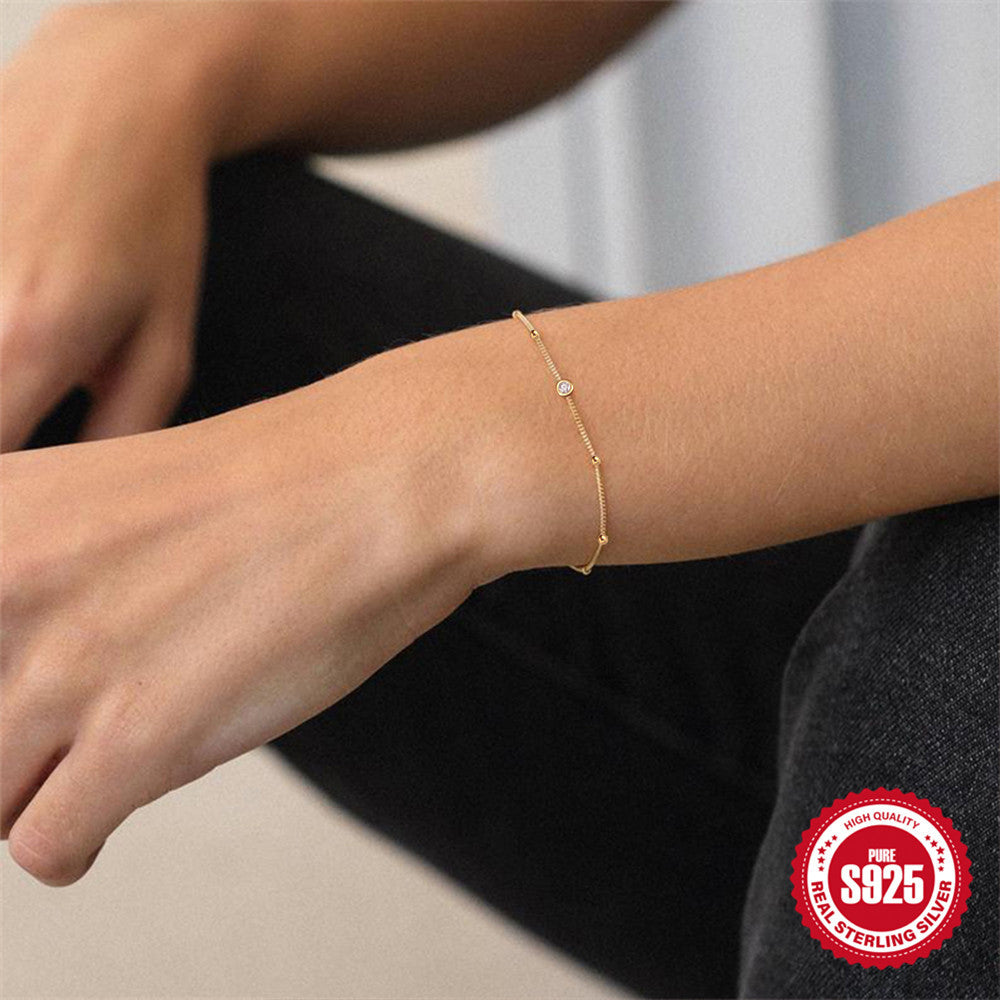 925 Sterling Silver Beaded Zirconia Station Bracelet — gold bracelet worn on wrist