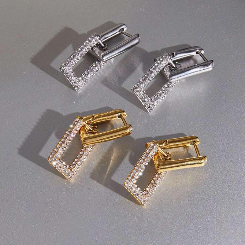 Gold and silver tone rectangle drops displayed flat