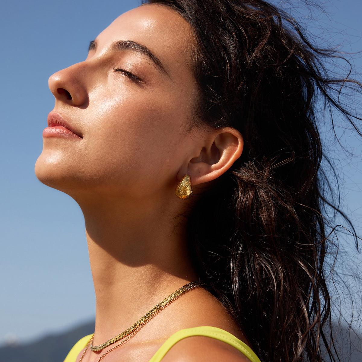 Rounded teardrop earring shown in side profile