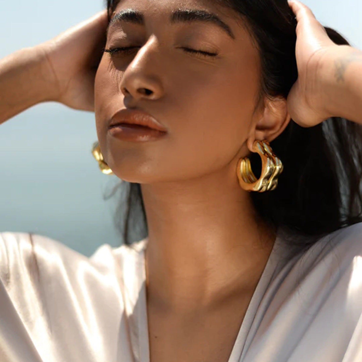 Gold Plated Sculptural Petal Stainless Steel Hoop Earrings – product view 2