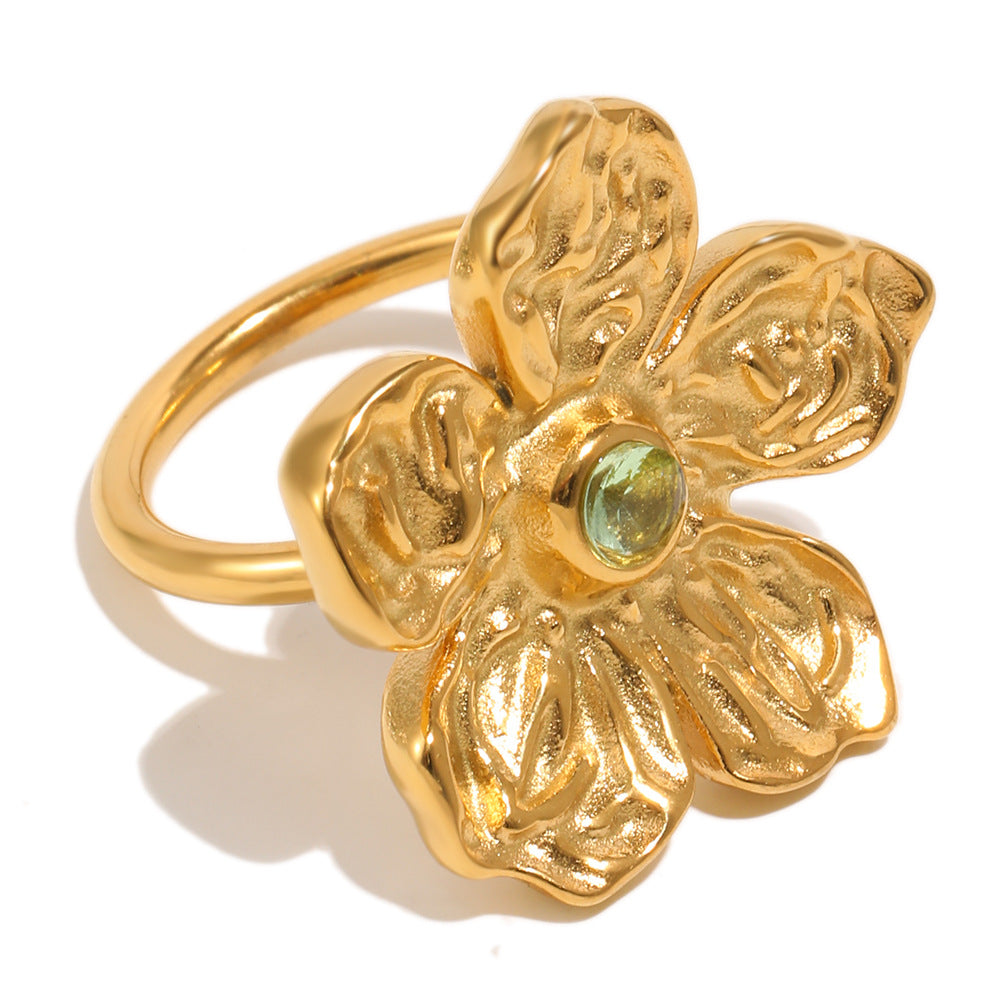 isolated gold plated stainless steel flower ring with rippled petals