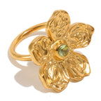 isolated gold plated stainless steel flower ring with rippled petals