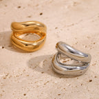 gold plated and silver-finish sculptural triple-band stainless steel rings