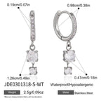 Silver tone huggie with two clear stones and drop measurements