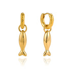 Polished fish charms and textured hoops on white