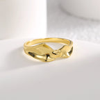 front view of fluid double-ridge crest on gold plated ring