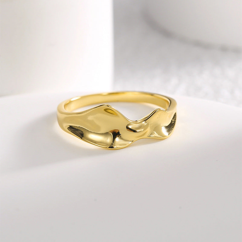 front view of fluid double-ridge crest on gold plated ring