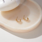 Open hoop pair showing stud posts on a tray