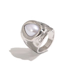 Silver tone hammered stainless steel ring in three-quarter view