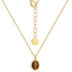isolated gold plated tiger's eye pendant necklace on white