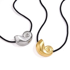 Two spiral shell cord necklace options on white