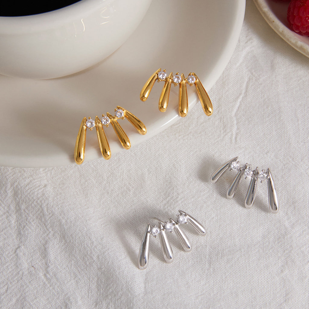 Two finishes of elongated drop fan earrings