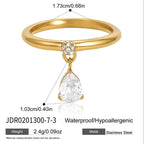 Gold-tone ring with pear-shaped drop